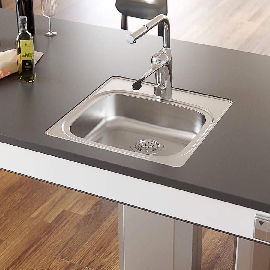 The kitchen island can be designed to suit individual needs. Here, an inset sink with a shallow sink bowl has been integrated with the kitchen island.